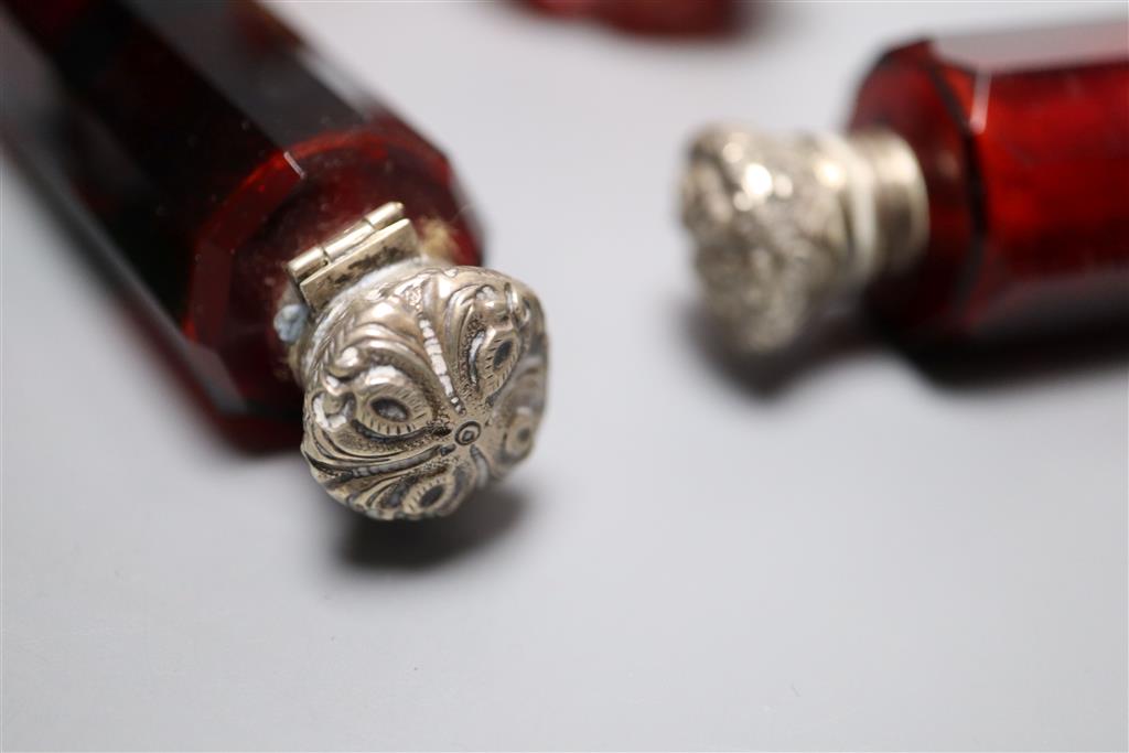 A Victorian double-ended blue glass lattice scent bottle, two double-ended ruby glass bottles and four other scent bottles